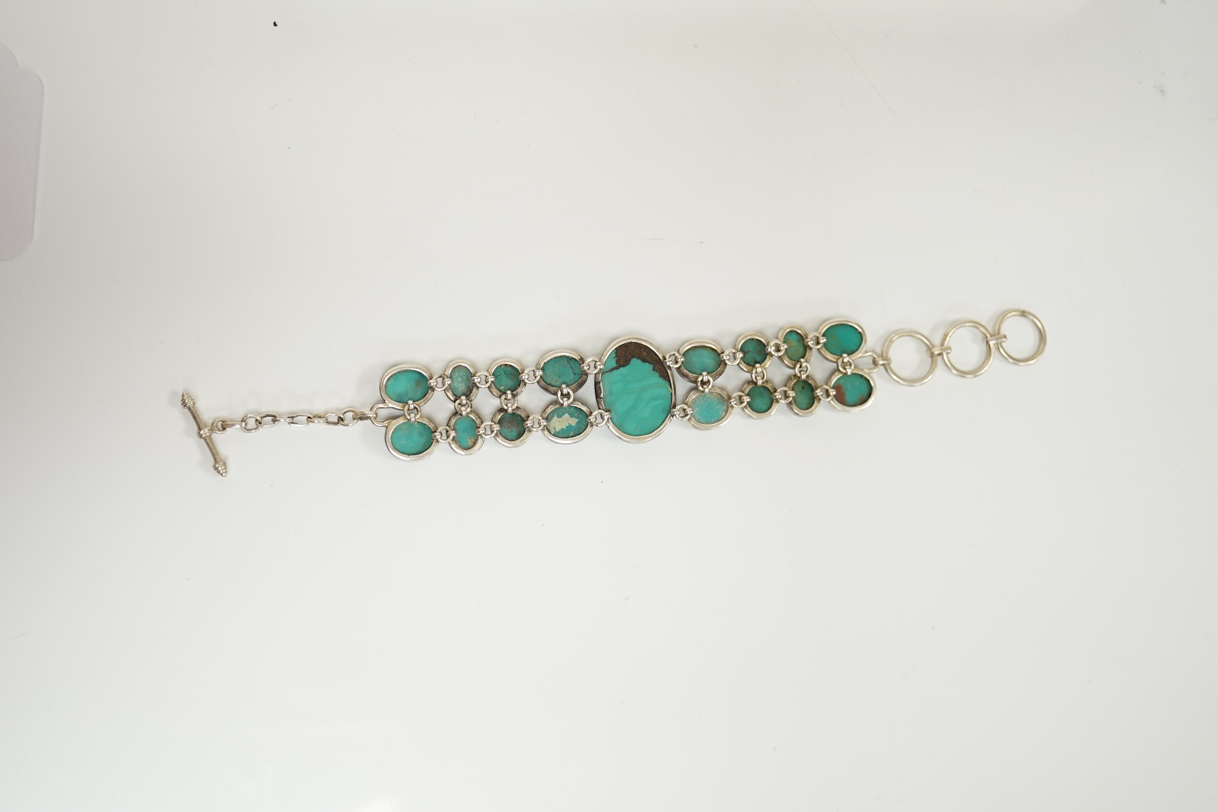 A modern silver and two row turquoise cluster set bracelet, overall 22cm. Condition - good